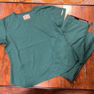 Sketchers scrubs, tops, and bottoms, brand new condition, never worn